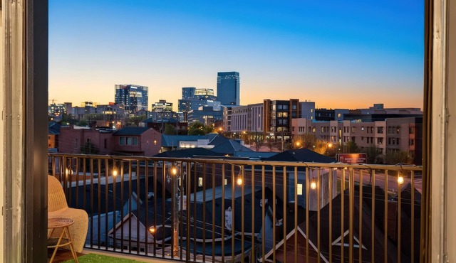 Summer rooftop deck, skyline views, garage door near Broadway