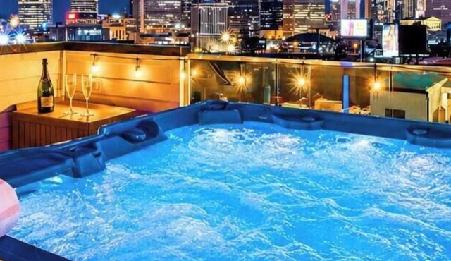Summer rooftop hot tub, karaoke lounge, skyline views near Broadway
