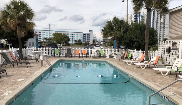 Sun, Sand & Pool! One block from the beach!