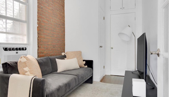 Sunlit LES 1BR w/W/D, steps to B/D train, by Blueground