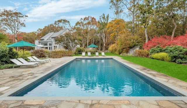 Sunlit Retreat with Pool, Tennis Court, and Seamless Indoor-Outdoor Living.