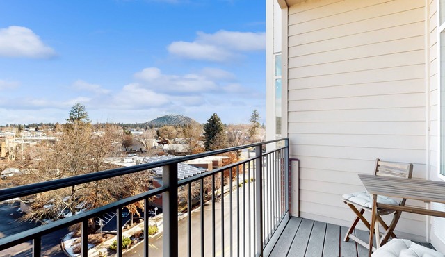 Sunny condo with open layout, smart TV, balcony, W/D, & AC - great location