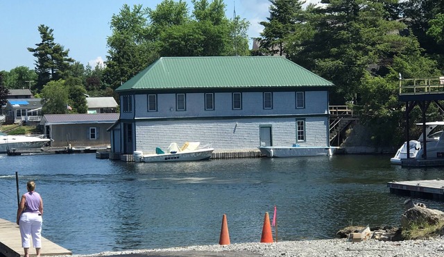 Sunny cottage built over the water on the St. Lawrence River