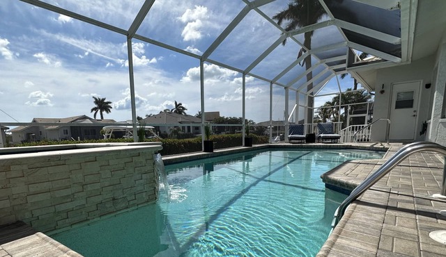 Sunny Pool & Spa inside Lanai! Dock and Water access! 3bd 2bath home.