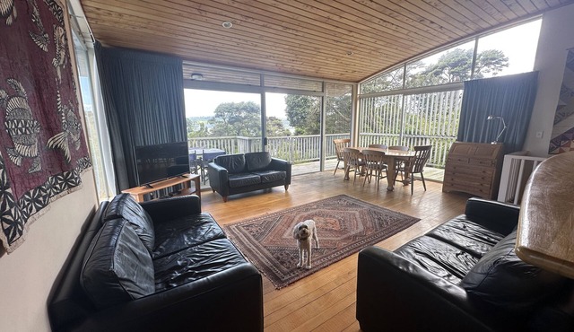 Sunny with decks and bush/harbour views. Three bedrooms. Pet friendly.