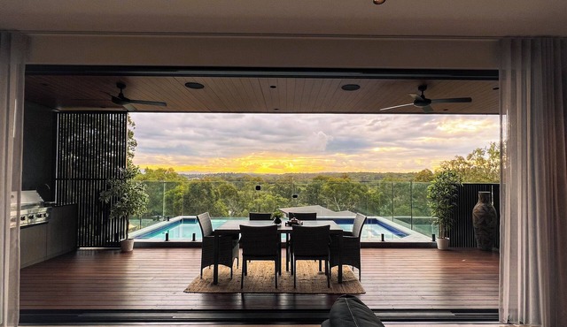 Sunsets views by the infinity pool overlooking a Koala Eucalyptus Reserve.