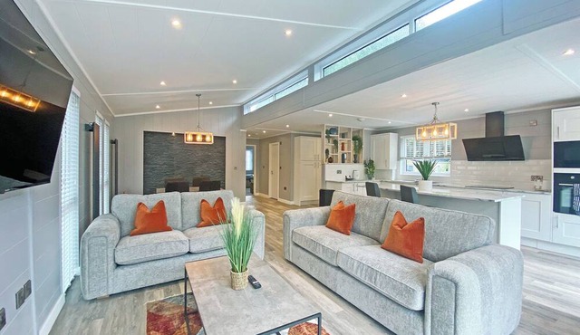 Super spacious modern lodge with large balcony and hot tub.