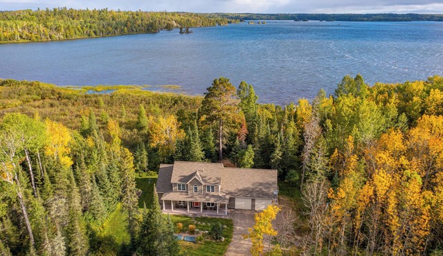 Superb 4-bedroom house on Shagawa Lake with dock, boat lift, and total comfort.