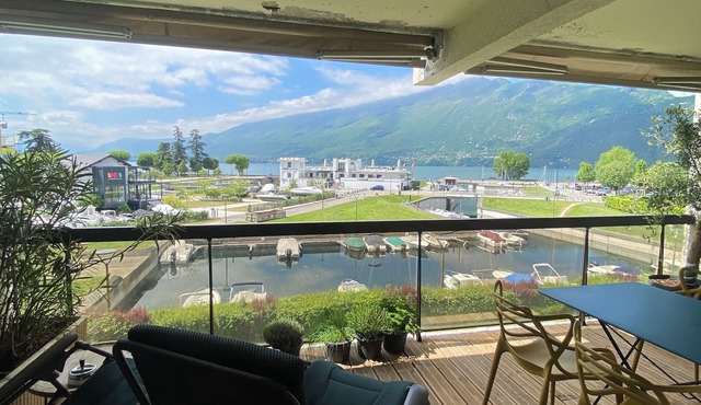 Superb apartment in small harbor with lake and marina views.