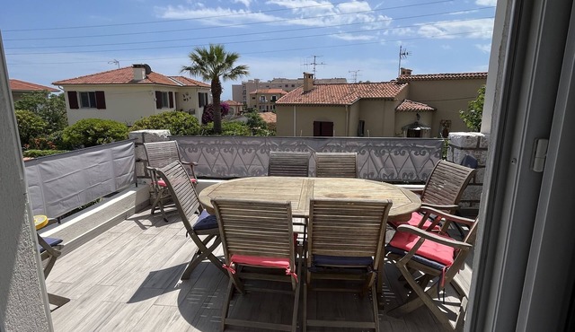 Superb upstairs villa with private garden and parking.