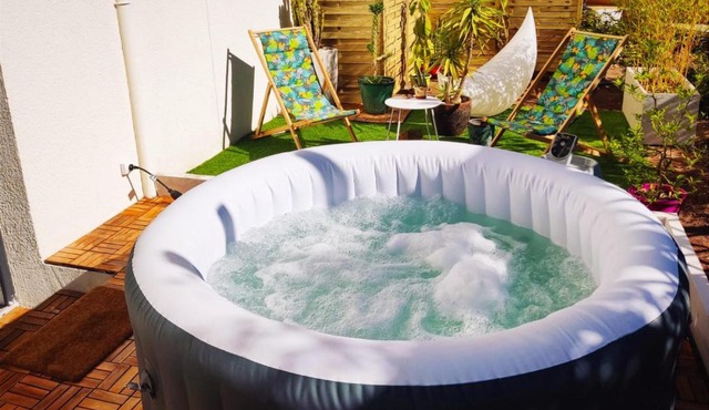 Superbe appartement avec jacuzzi avec jardin privé