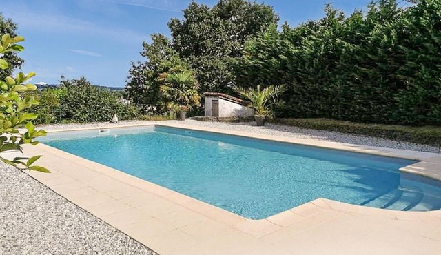 Surrounded by green and quiet countryside welcomes you this cozy cottage with communal pool.