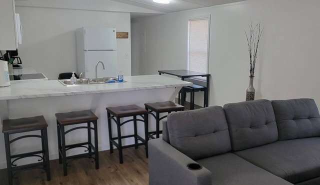 Surrounded by sweetgum and maple trees, this house is perfect for some R & R.