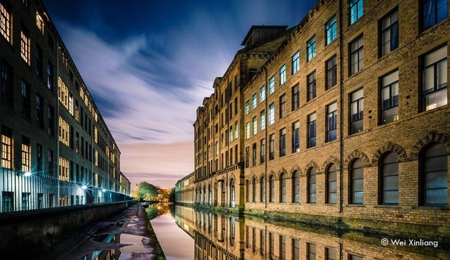 Swans glide past your window on the canal in this luxury Apartment