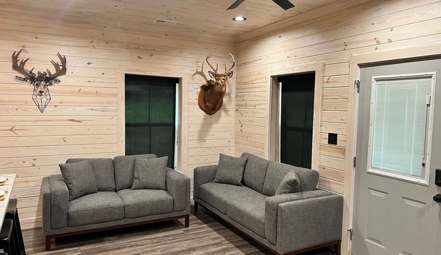 TAKE IT EASY Fishing Cabin. Large enclosed bay for storing the boat.