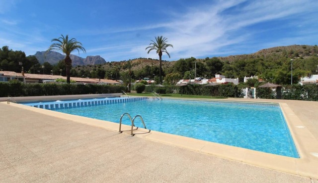 Terrace house with communal swimming pool