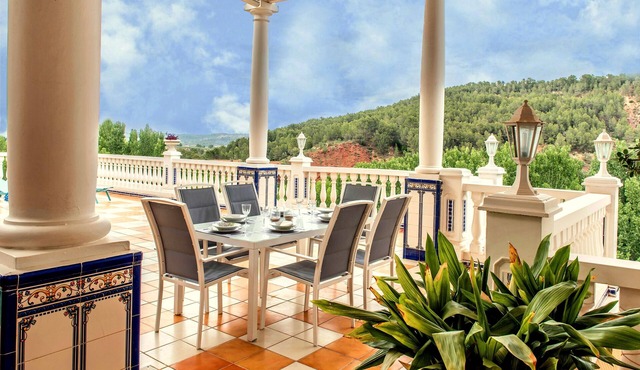 That impress patio overlooking mountains and the sound of water in the fountain