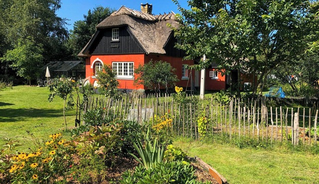 Thatched house from 1924 close to the beach