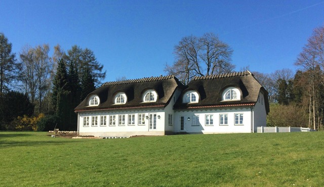 Thatched landmark in the forest by Valdemar Castle