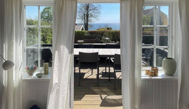 Thatched wooden house with sea view