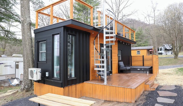 The Bellefonte Campground presents: The Luxury Hideaway Container Home, hot tub, Rooftop veranda, and more.