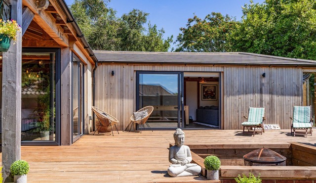 The Cabin - nestled within neatly landscaped gardens in the residential village of Hill Head