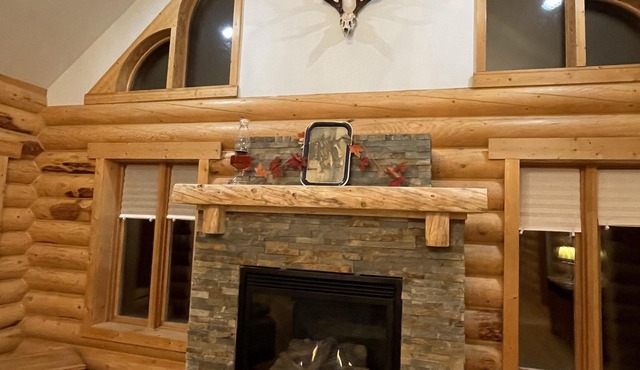 The Canada Goose Lodge . Cozy up by the fire in this secluded Log Lodge.
