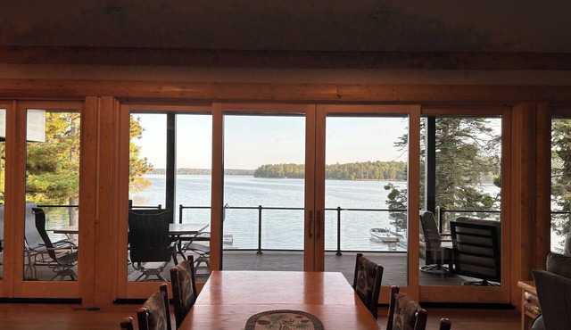 The Canopy with a wall of windows overlooking Big Sand Lake.