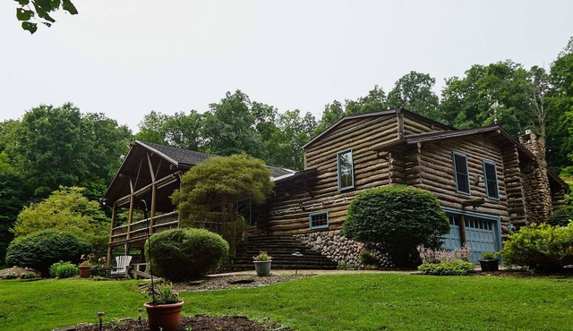 The Chalet of Canandaigua, luxury log cabin on 30 acre property with acre pond