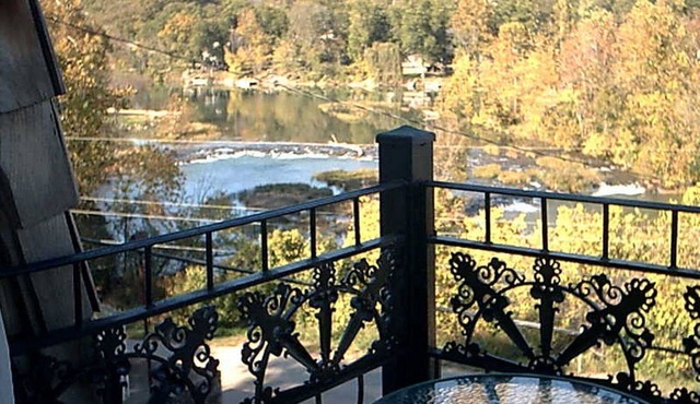 The charming French Chateau overlooks the beautiful falls of the Spring River