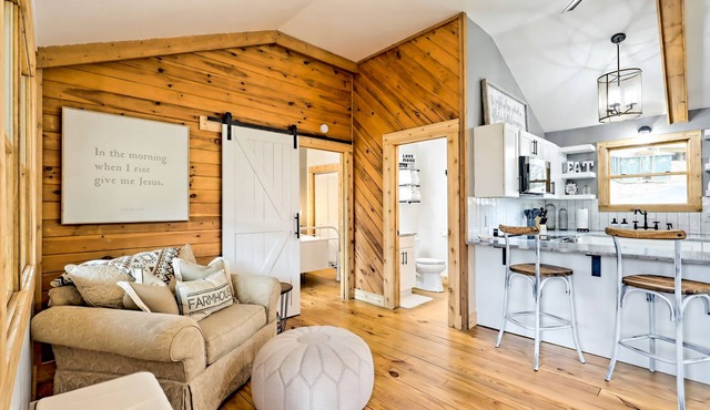 The Coop | Woodland cabin in Blairsville with wraparound porch & fireplace