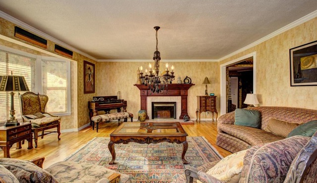 The Doll House an eclectic style of art and old fashioned doll and antique collections in a doll house designed home in Boise's desirable North End across from a nice park with tennis and basement and walking trails near shopping, hiking, biking, skiing