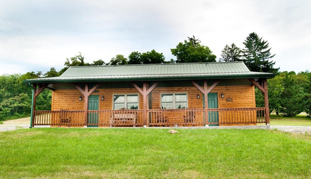 The double cabin has 2 queen beds, 1 king bed, 1 sleep sofa for 1 child. Cabin has common porch and each unit has a private entrance.