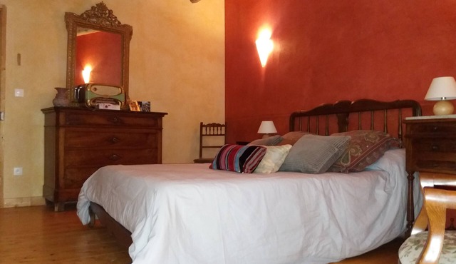 The eighteenth century house is opposite the fortified church of the village.