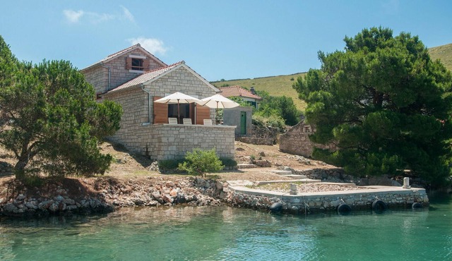 The extremely beautiful stone villa Kornati is located in central Dalmatia, south of Zadar and west