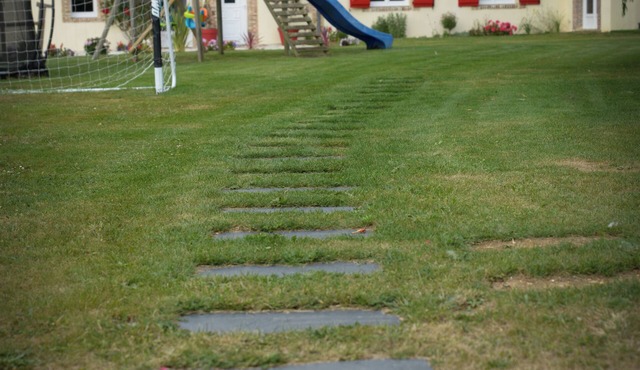 The farmhouse with the red shutters