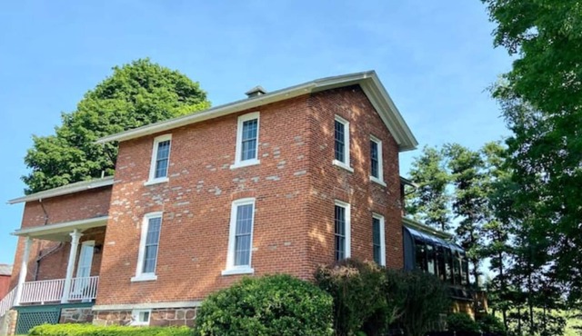 The farmhouse at Hagen Acres, nestled in apple orchards country