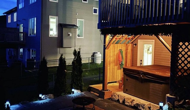 The Governor's Suite - An executive oasis featuring a hot tub, fire pit and BBQ!