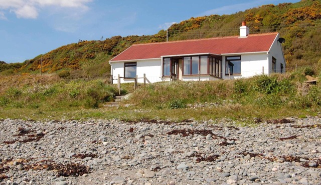 The Haven nestling in an idyllic setting on the shore of Luce Bay in Galloway a