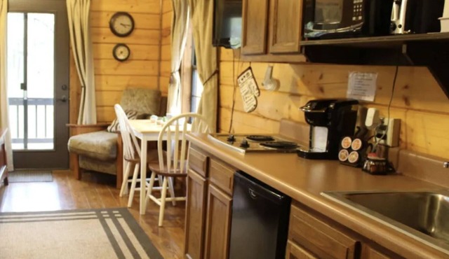 The hideaway retreat cabin has views of open fields and sweet water lake.