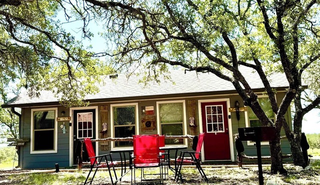 The Hitchin' Post Cabin- Texas Hill Country Western-themed cabin for 4 in the woods near Kerrville & Fredericksburg