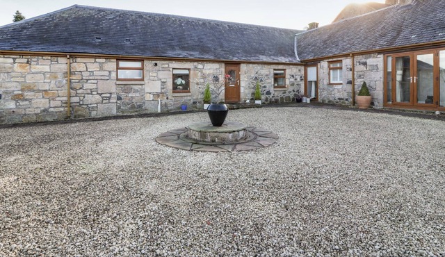 THE KIRKLANDS COTTAGE, with a garden in Eaglesham, Glasgow