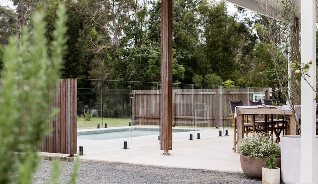 The Lake House - Escape the hustle and bustle and relax around the pool.