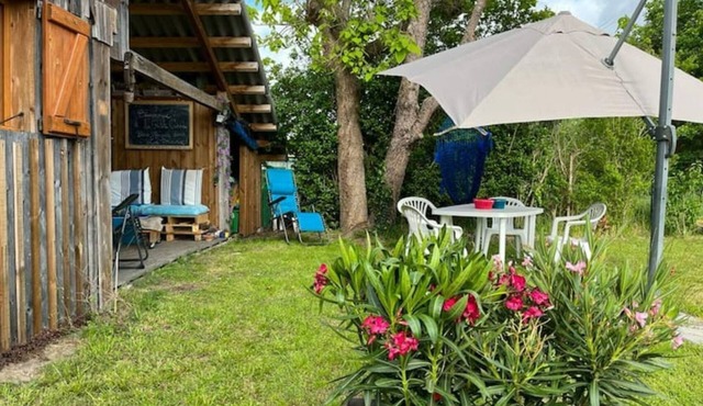 The little blue cabin hidden in the meadow