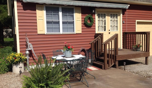 The Little Red Cottage is situated in a quaint country neighborhood