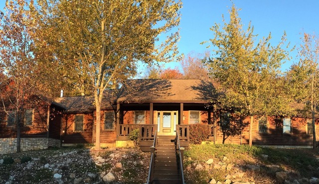 The Lodge at Harvest Moon sleeps 16 with five bedrooms and unique private Pub