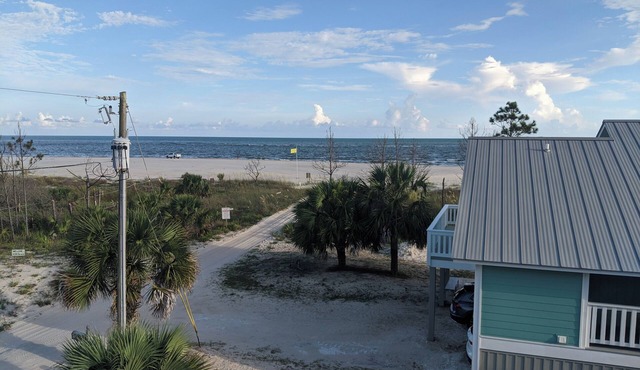 The Lucky Dog Beach House steps from the beach.