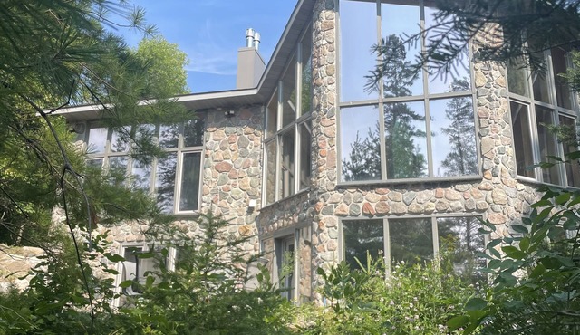 The newly remodeled Stone Cabin with sandy beach and clean clear water