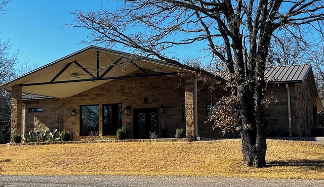 The Oaks, a stunning 2-bedroom 2-bath home on 3 private acres in Granbury