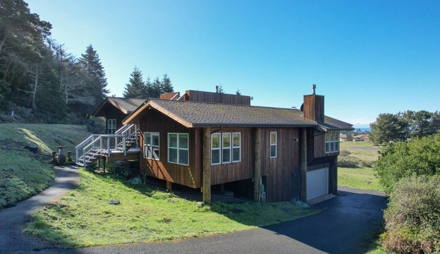 The ocean meets the meadow at the forest's edge. Private beach. Soak under stars